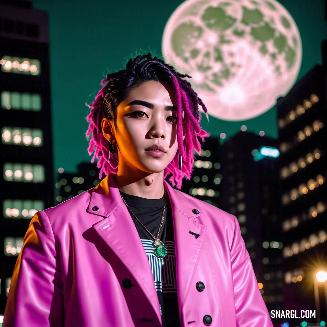 Woman with pink dreadlocks standing in front of a full moon in a city at night