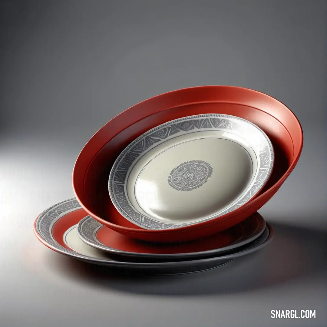 Persian plum color example: Set of three red and white plates on a table top with a gray background
