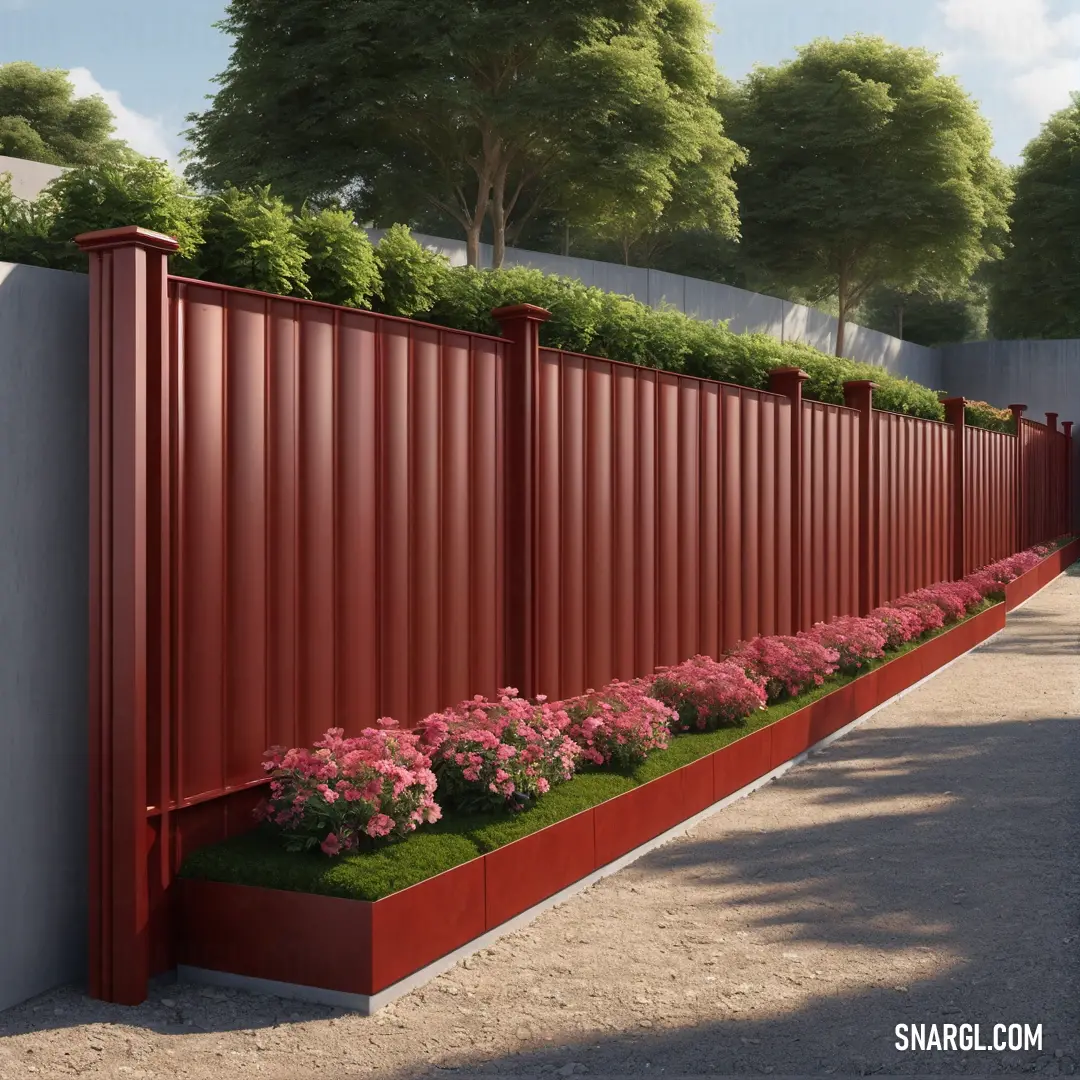 Red fence with flowers growing on it and a sidewalk in front of it with a sidewalk and trees. Color #701C1C.