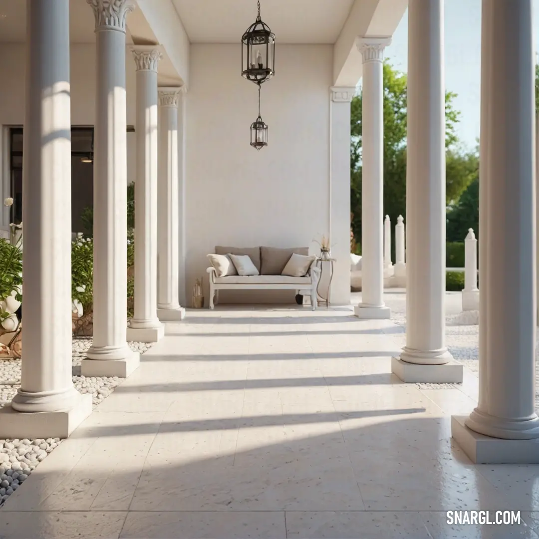 White porch with columns and a couch on the side of it with a light fixture hanging from the ceiling. Color Platinum.