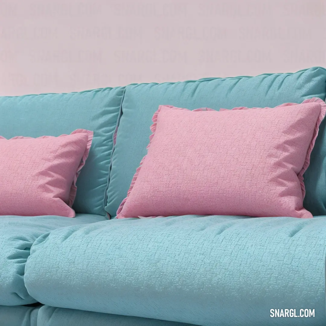 Blue couch with pink pillows and a pink wall behind it and a pink wall behind it and a pink wall behind it. Example of CMYK 0,28,0,13 color.