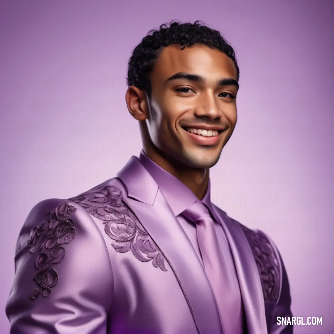 Man in a purple suit smiling for a picture. Example of #DDA0DD color.