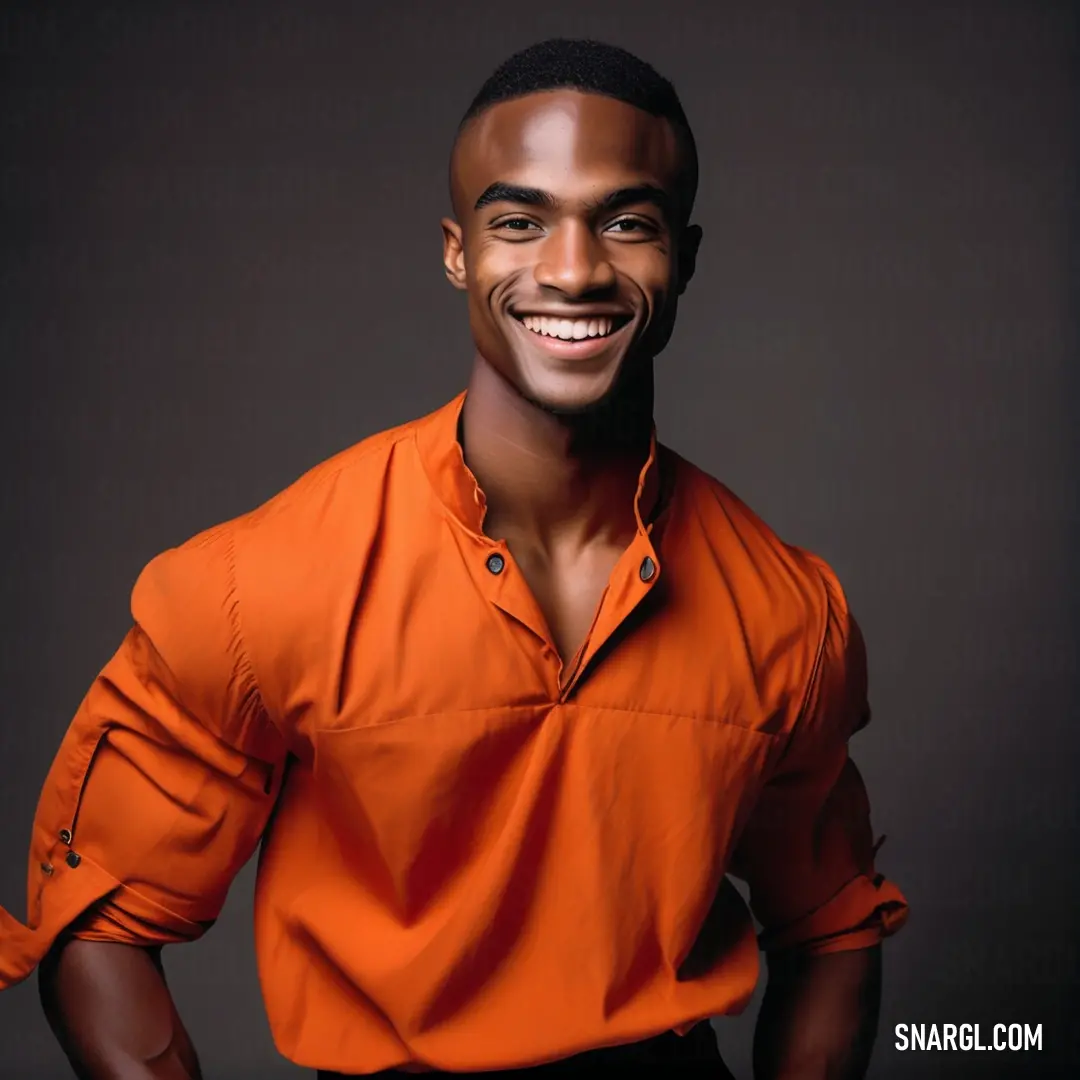 Portland Orange color example: Man in an orange shirt smiling for a picture with his hands in his pockets