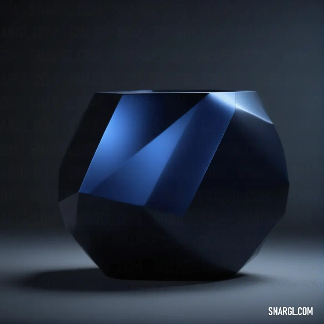 Black vase with a blue design on it's side and a black background. Color #003153.