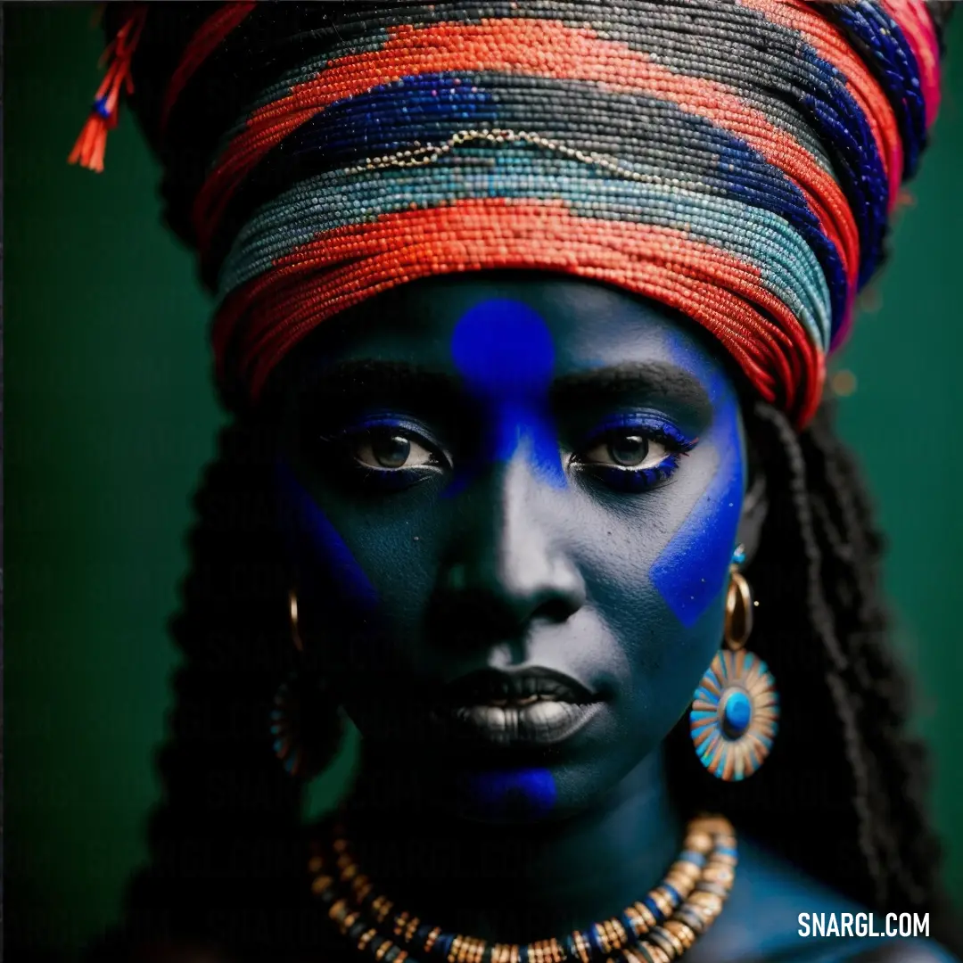 Woman with blue face paint and a headdress on her head and a necklace on her neck