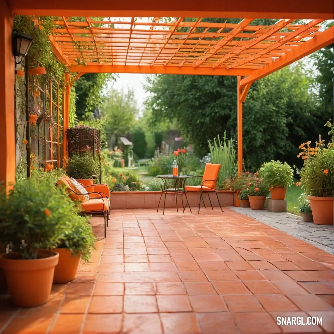 Patio with a table and chairs and potted plants on the side of it. Example of Pumpkin color.