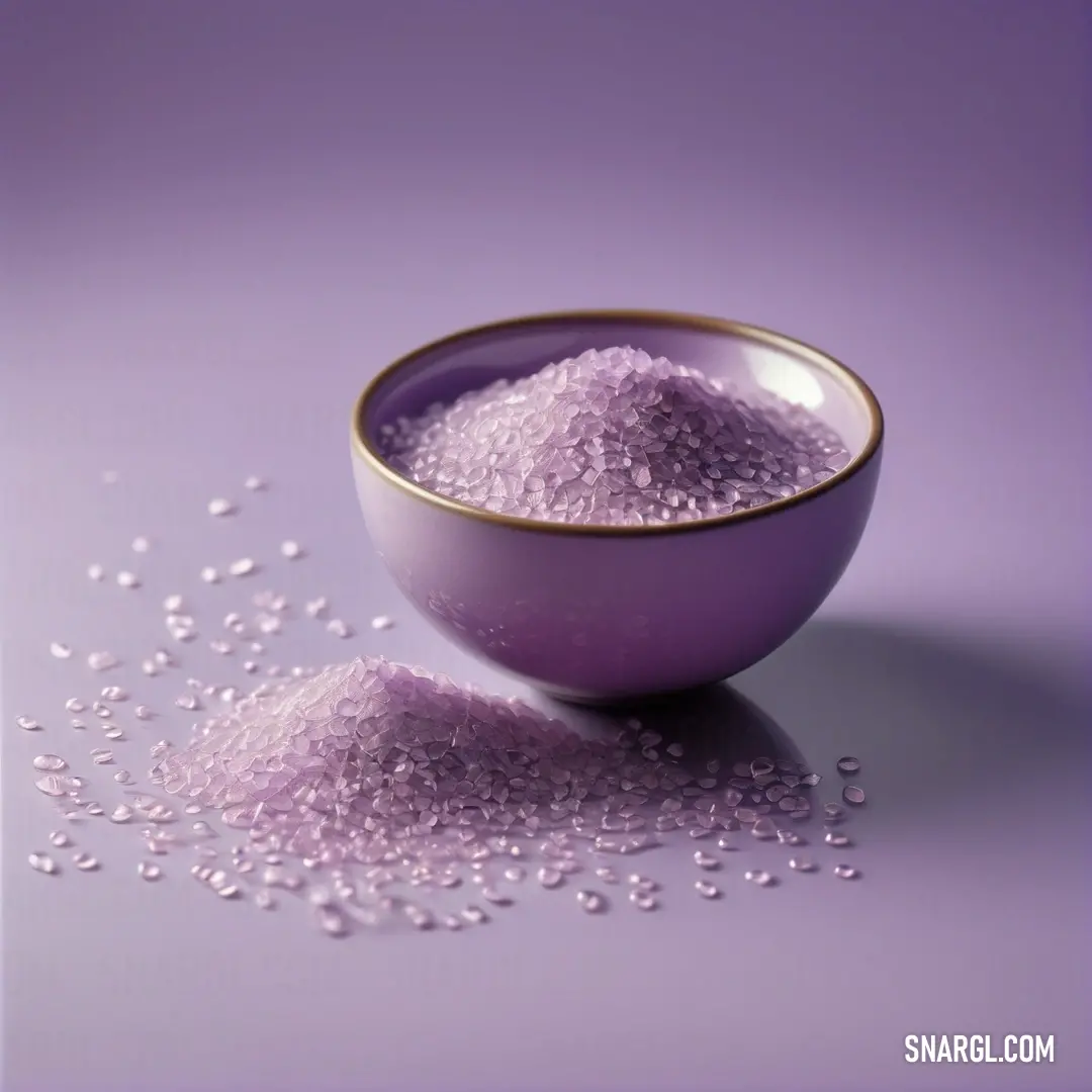 Bowl of purple sugar on a purple background. Color #9D81BA.