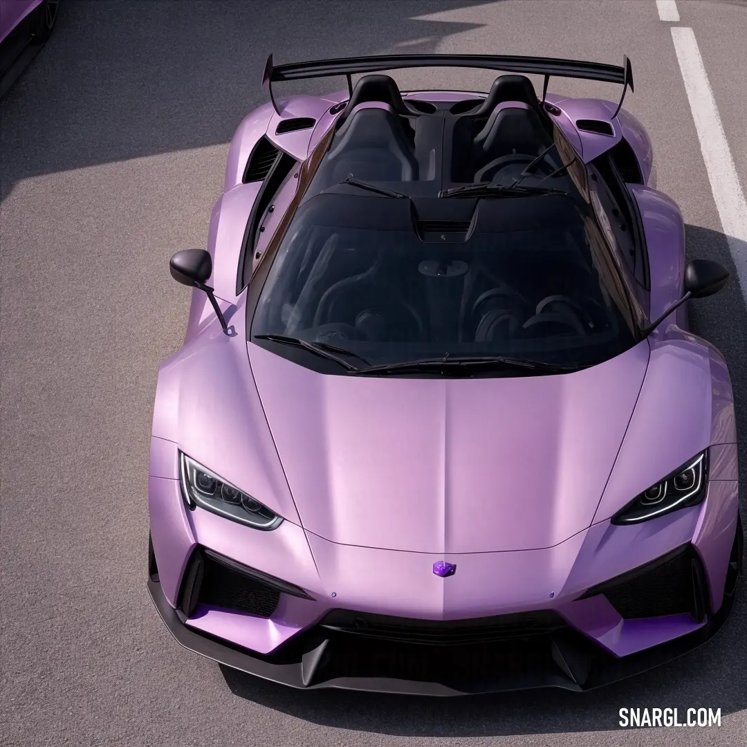 Purple sports car is parked on the street with its hood up