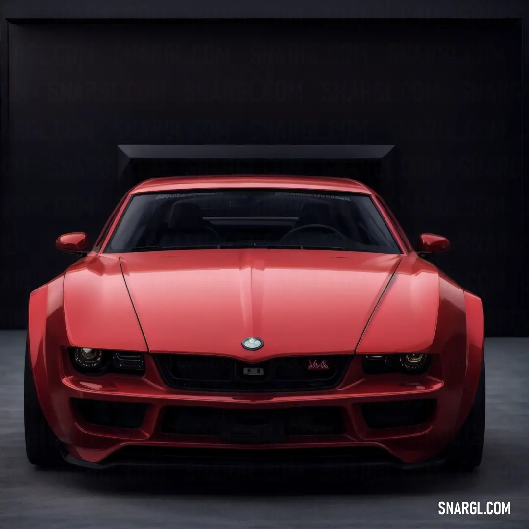 Red sports car parked in a garage with a black background. Example of #B7363A color.