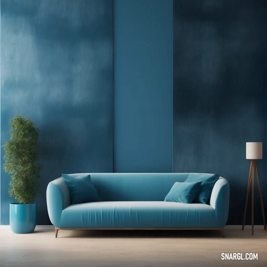 Blue couch in a living room next to a lamp and a plant in a vase on a wooden floor. Example of CMYK 70,17,30,10 color.