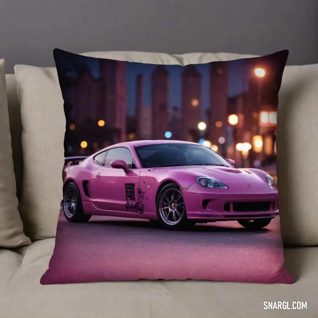 A charming pillow cover showcasing a vibrant pink sports car cruising through a city street at night. The rich colors and design evoke a sense of adventure, perfectly complementing the cozy couch it adorns, bringing style to your decor.