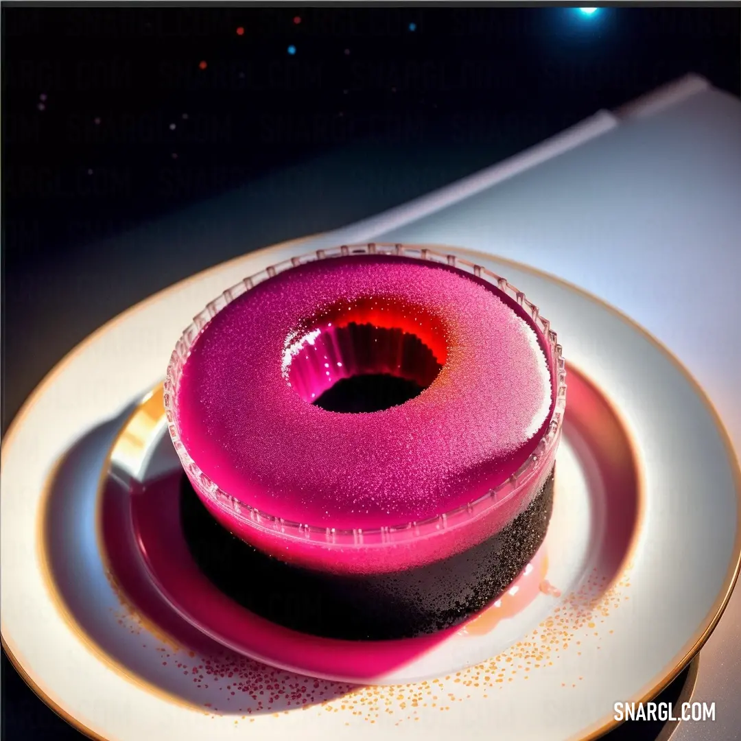Pink donut on a white plate with a gold rim and a black bottom