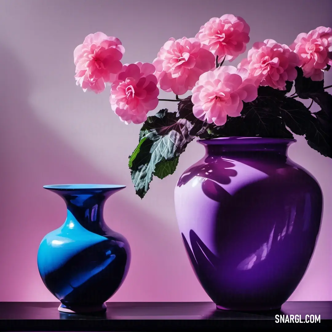 An elegantly styled scene featuring a purple vase adorned with delicate pink flowers, accompanied by a contrasting blue vase. The rich colors create a visually stunning composition that captures attention and enhances the space's charm.