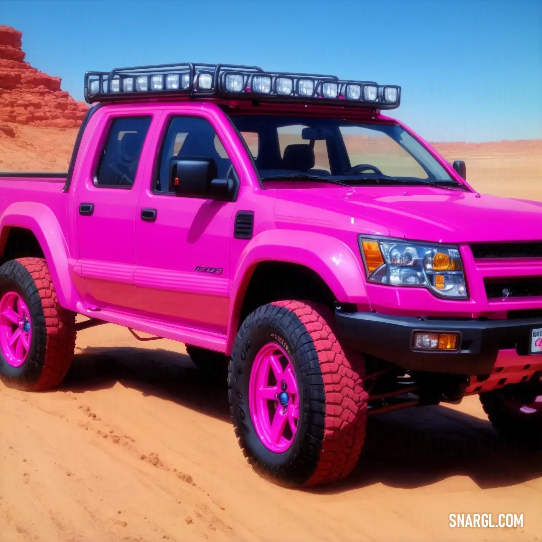 Pink truck with a bright pink paint job on it's tires and lights on the top of the truck