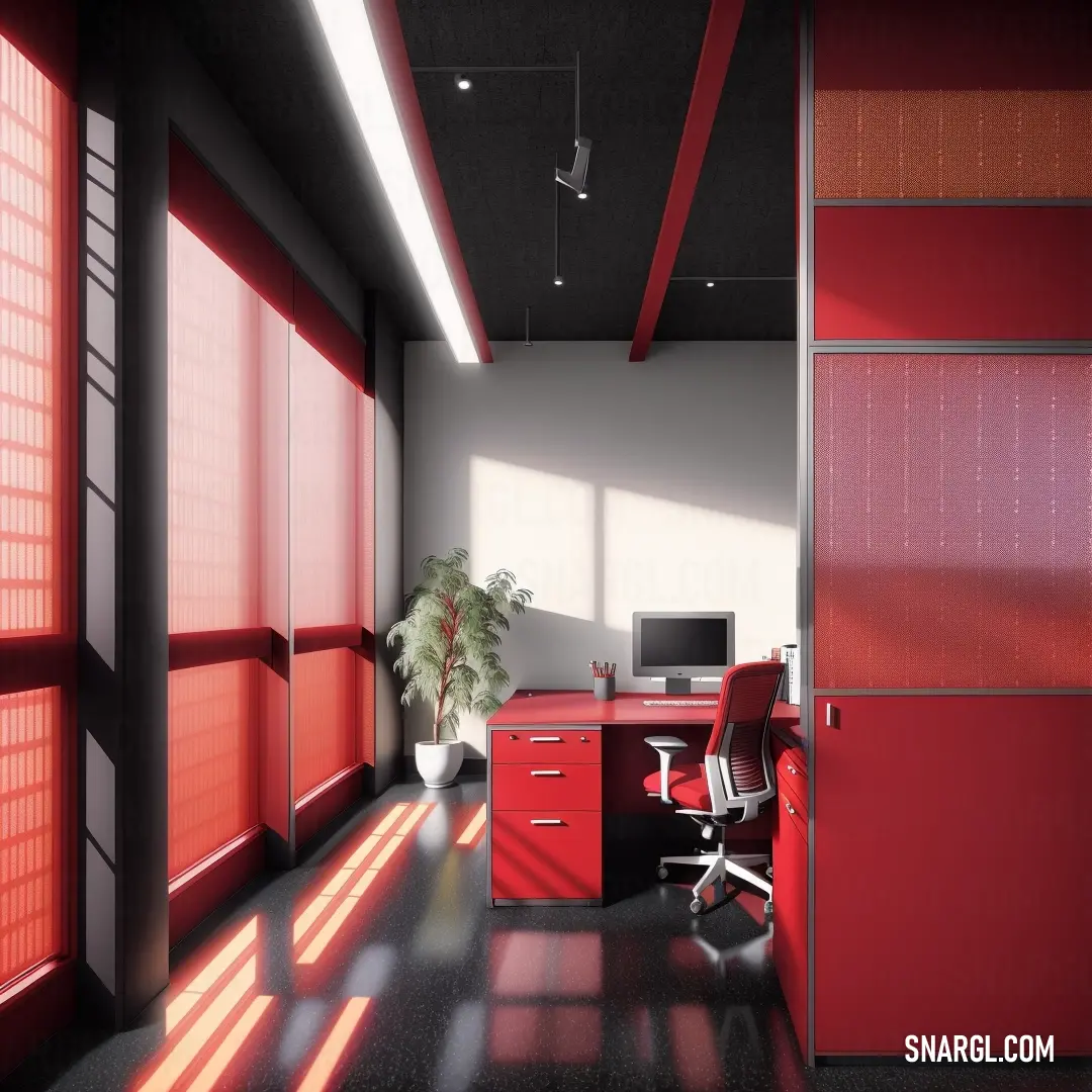 Room with a desk and a chair and a plant in it and a red cabinet