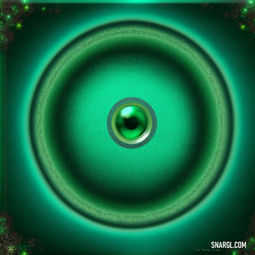 Green circular object with a black center in the middle of it and a green background