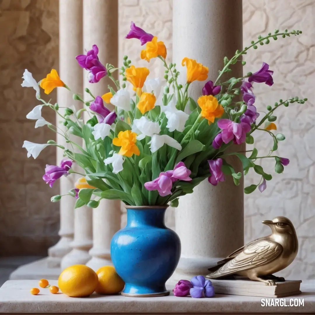 Blue vase filled with flowers and a bird next to it on a table next to a pillar and a book. Color #0892D0.