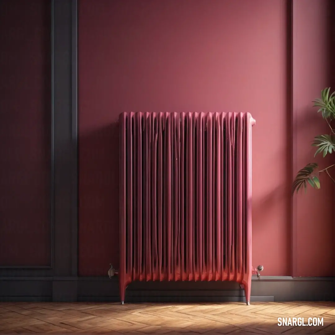 Red radiator in a room with a plant in the corner of the room and a red wall. Example of #B03060 color.
