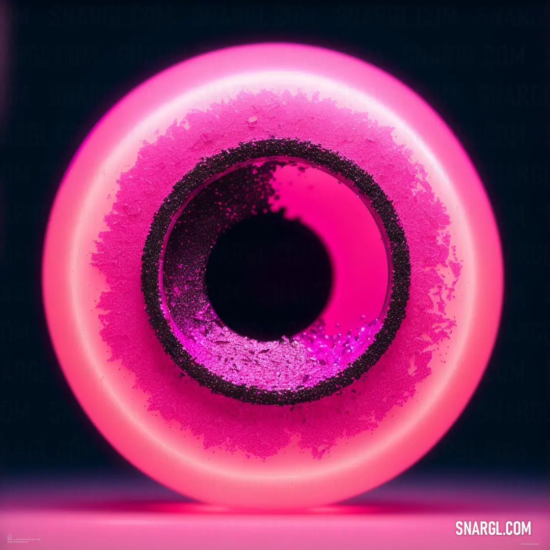 Pink and black object with a black center piece in the middle of it's center circle