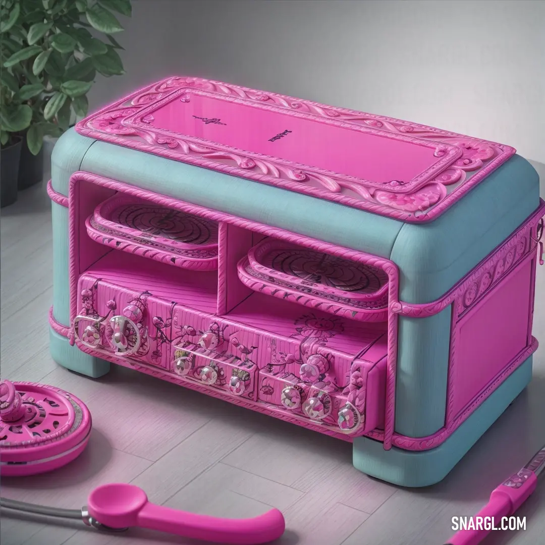 Pink and blue jewelry box with a pink toothbrush and a pink comb and scissors on a white table