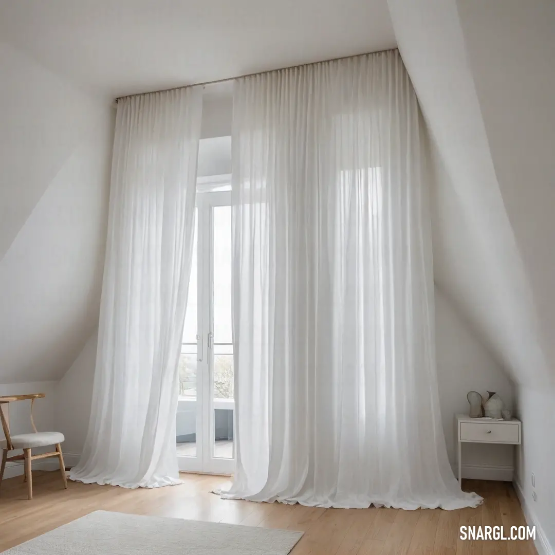 Bright and airy, this white room features a soft rug underfoot and flowing white curtains framing the window. A serene ambiance is created, inviting relaxation and simplicity into everyday life.