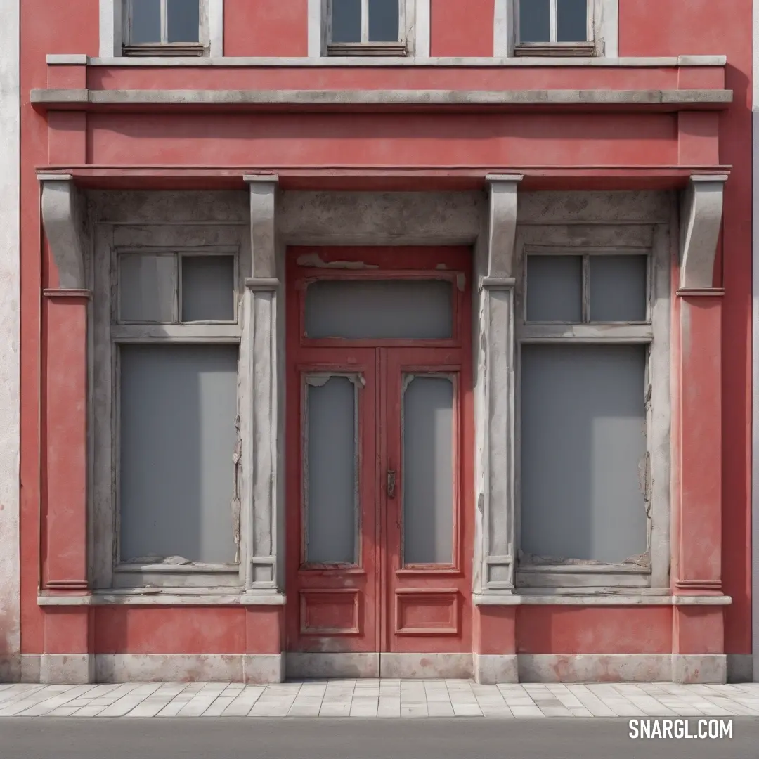 Red building with two windows and a red door on the side of it with a brick sidewalk in front of it. Example of #AB4E52 color.