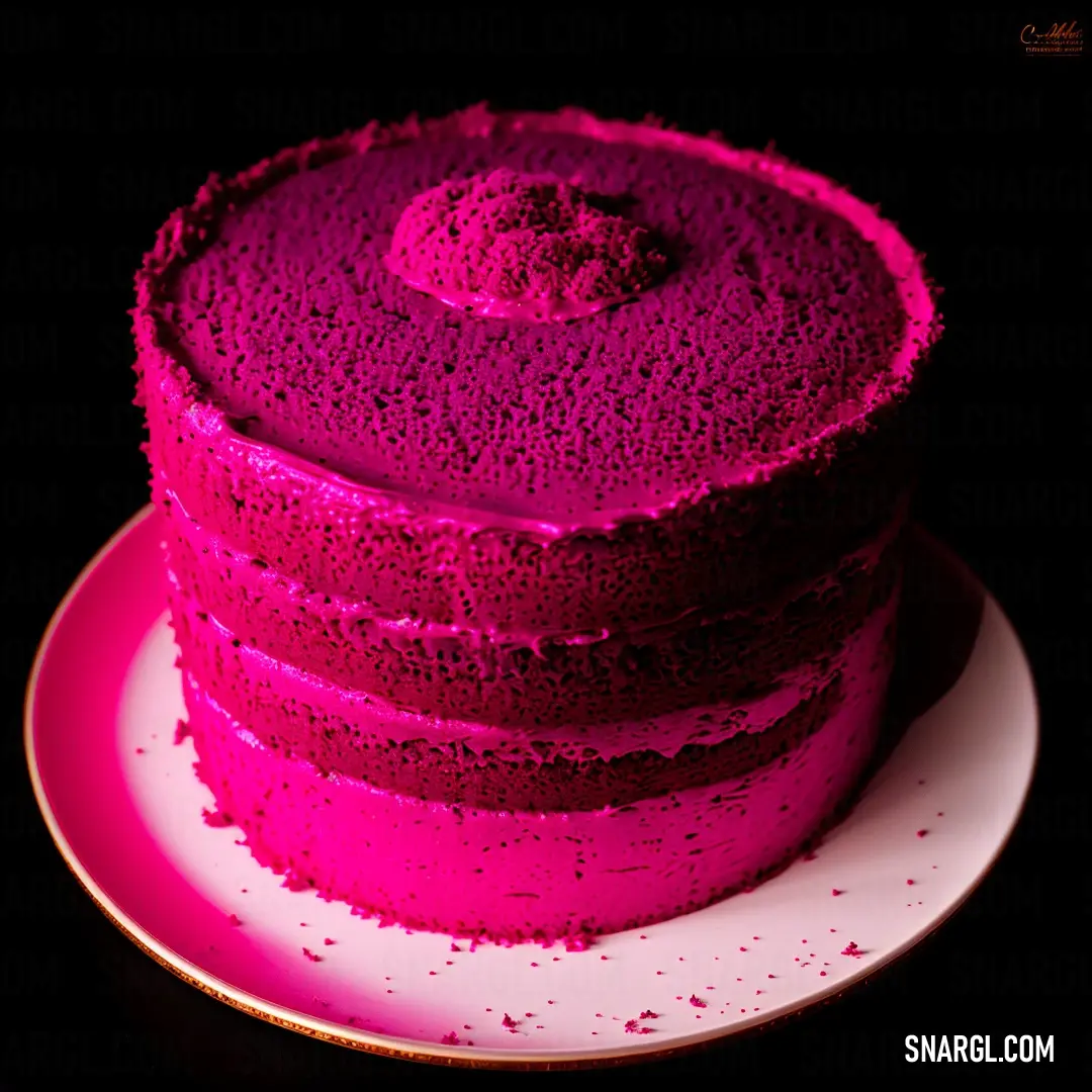Cake with pink frosting on a plate on a table with a black background