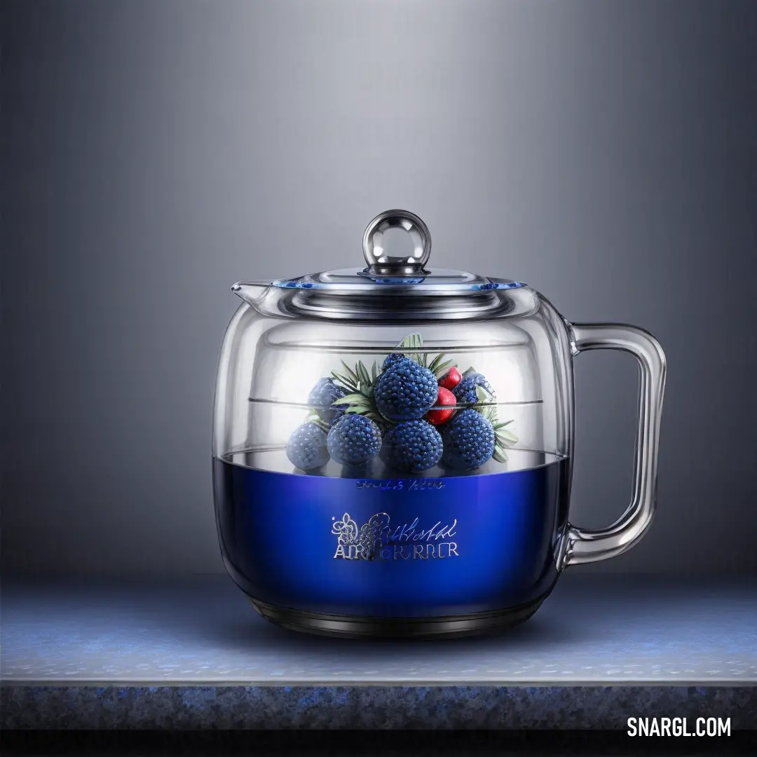 Glass teapot with a blue lid and a fruit inside of it on a table top with a gray background. Color CMYK 100,67,0,34.