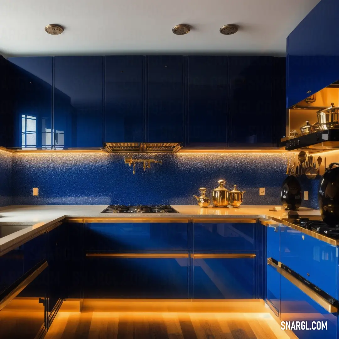 Kitchen with blue cabinets and a wooden floor and a stove top oven and microwave oven