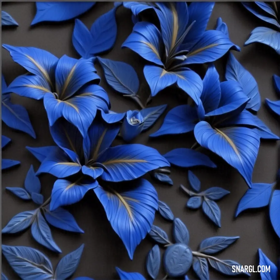 Blue flower with gold leaves on a black background with a silver frame and a black background with