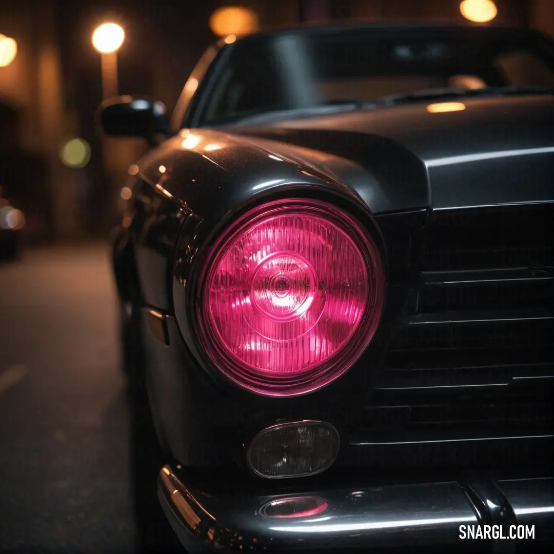 A striking close-up of a car's headlight, showcasing a bright red light that pierces the evening air, with a blurred street light adding to the urban ambiance. A moment of vibrant energy captured in the city.