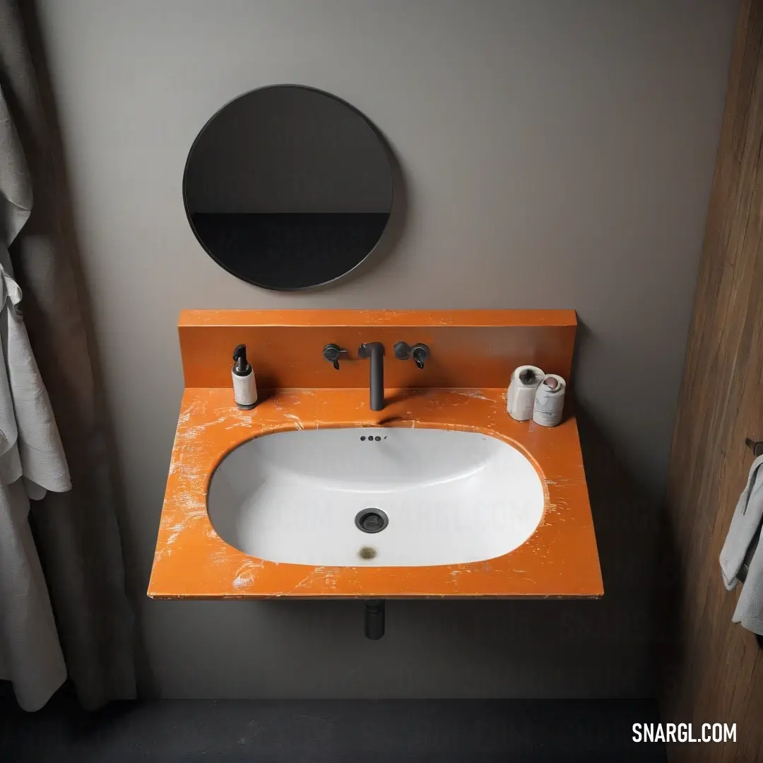 Bathroom sink with a mirror above it and a towel rack on the wall behind it. Color #BB6528.