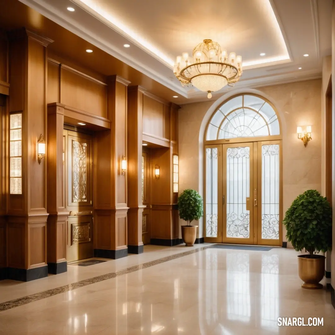 Large foyer with a chandelier and a potted plant in it's centerpieces. Color CMYK 0,45,79,50.