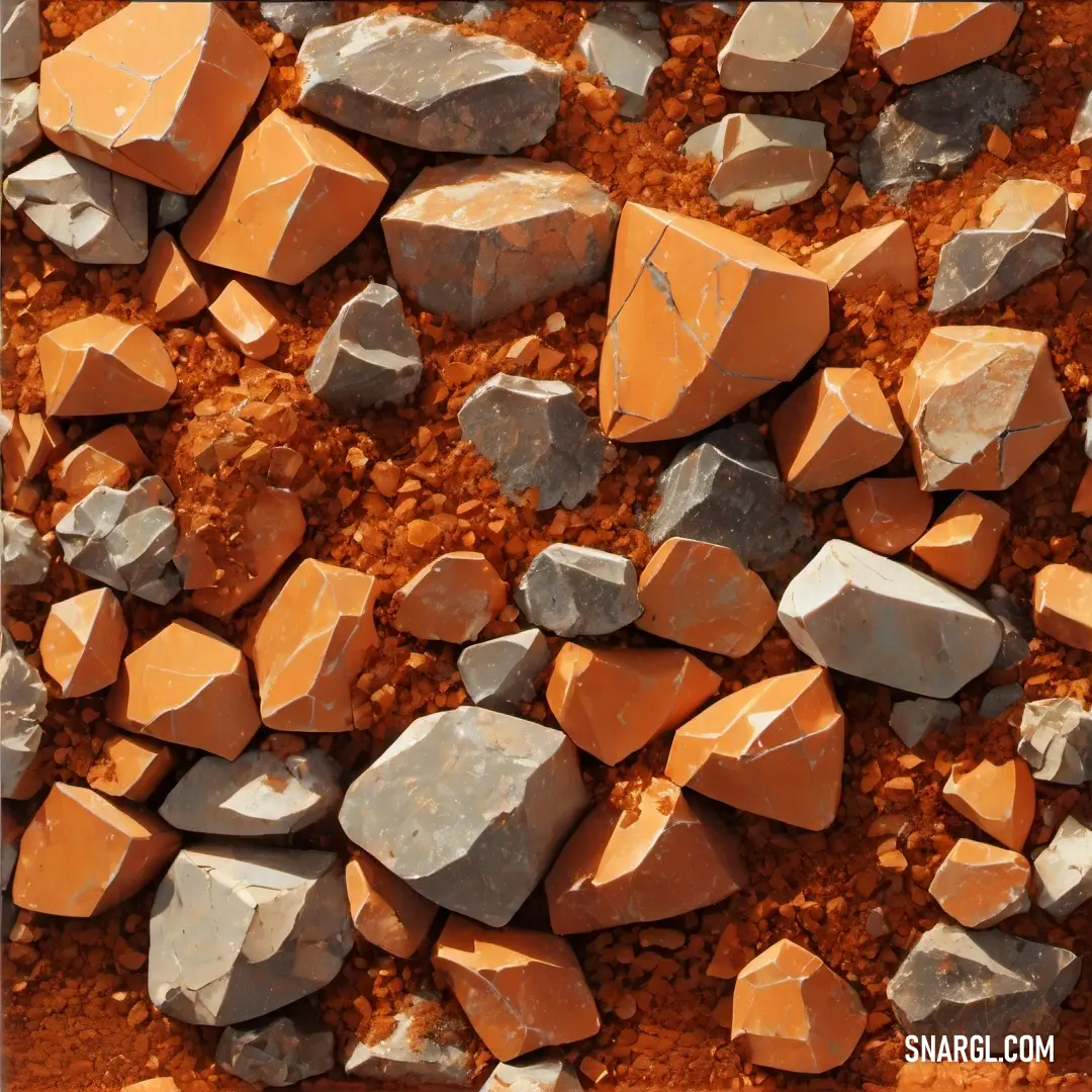Rust color. Pile of rocks and gravel with a red dirt ground in the background