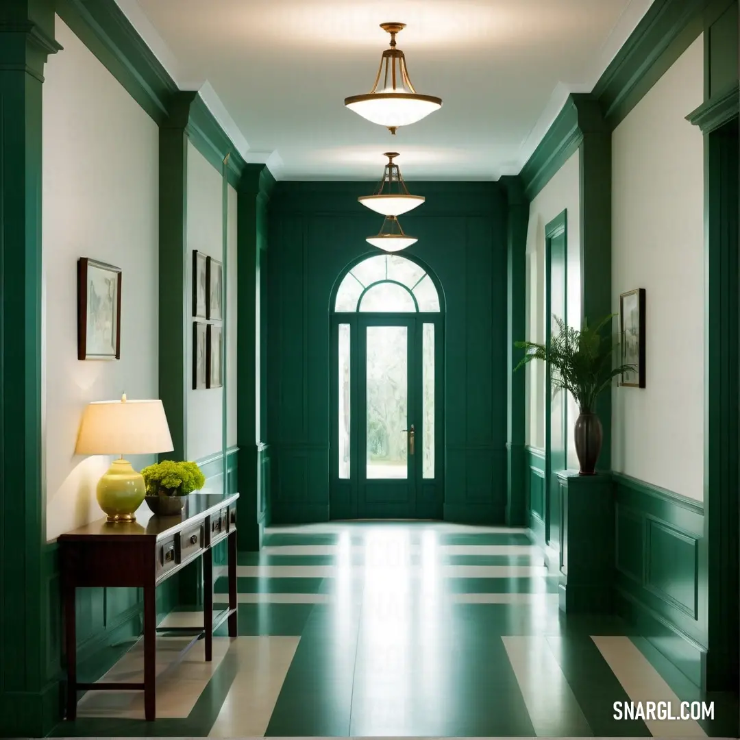 Hallway with a green door and a lamp on a table and a lamp on a table in front of it. Color Sacramento State green.
