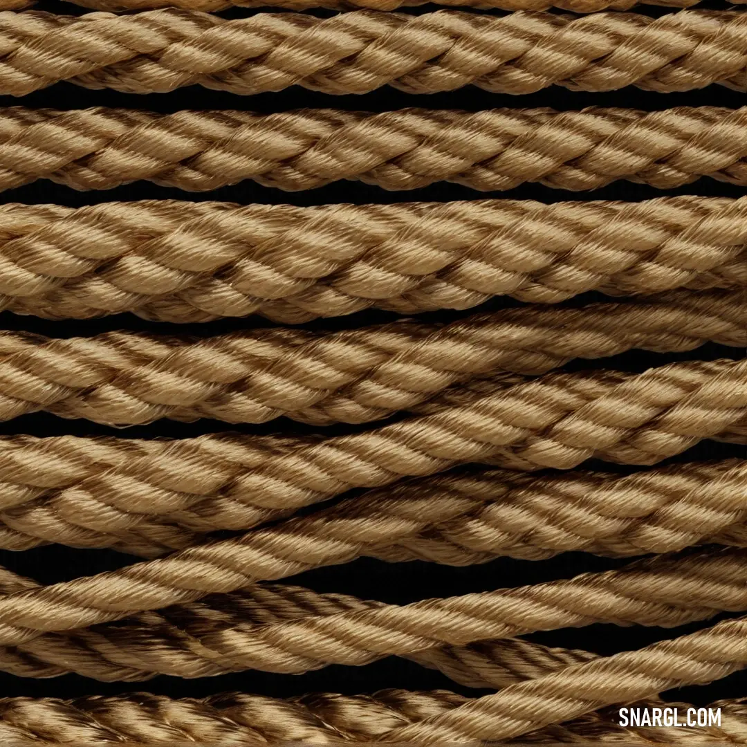 A close-up view of a rope against an elegant black background, revealing the intricate textures and patterns that highlight both strength and adaptability in the simplest of objects.