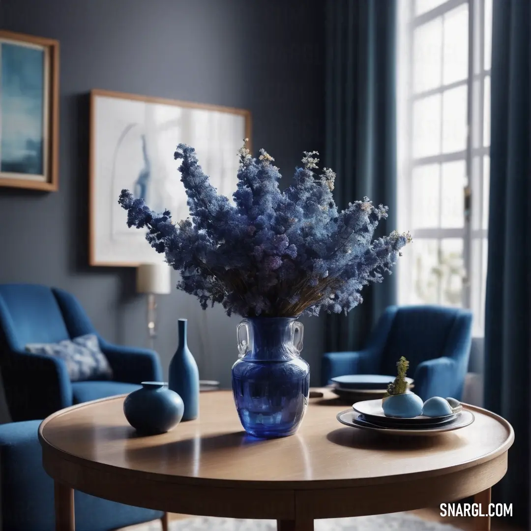 Vase of flowers on a table in a living room with blue chairs. Example of Saint Patrick Blue color.