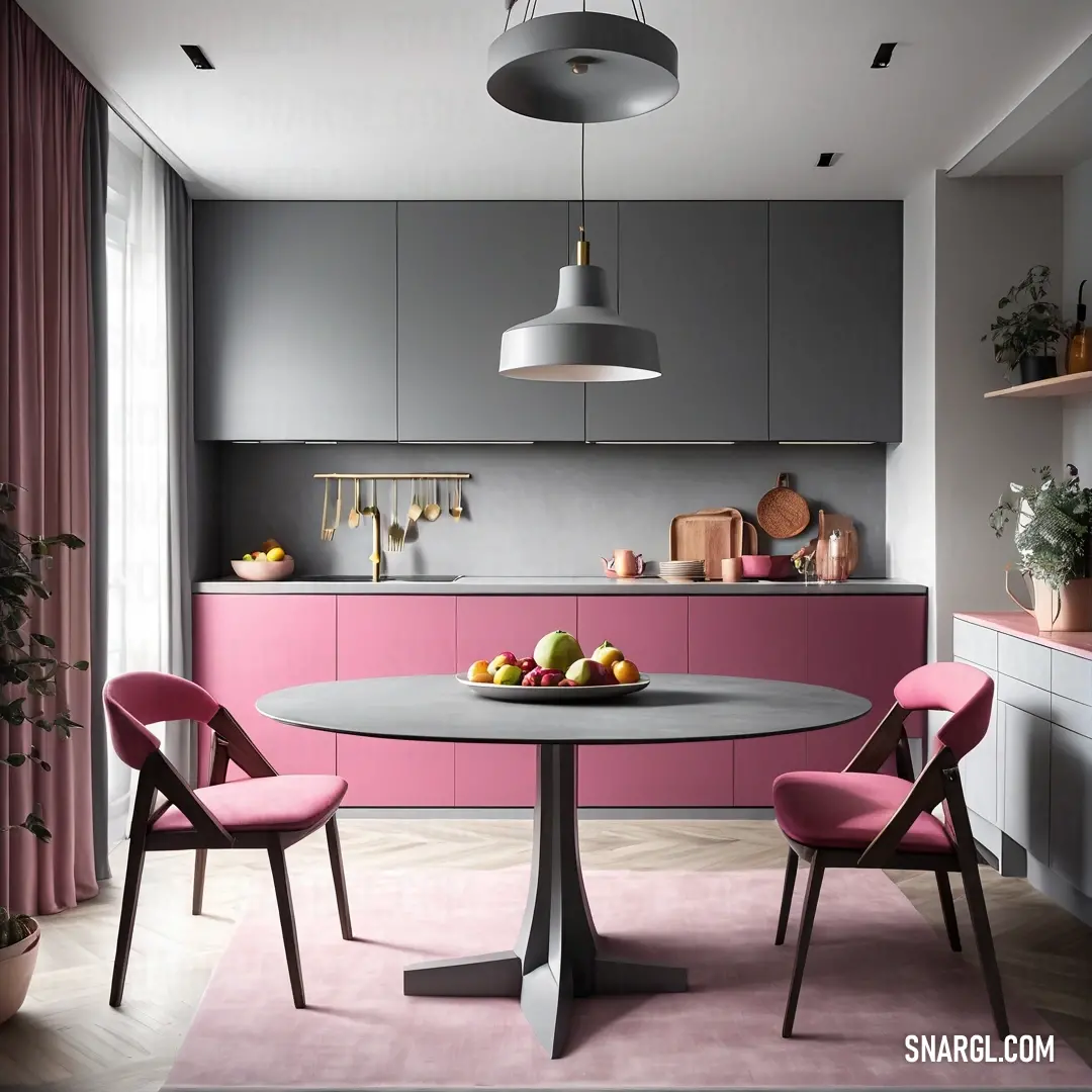 Kitchen with a table and chairs and a bowl of fruit on the table in front of the counter. Color CMYK 0,43,36,0.