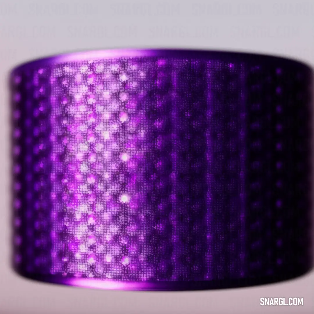 Purple ribbon with a pattern of dots on it. Example of #800080 color.