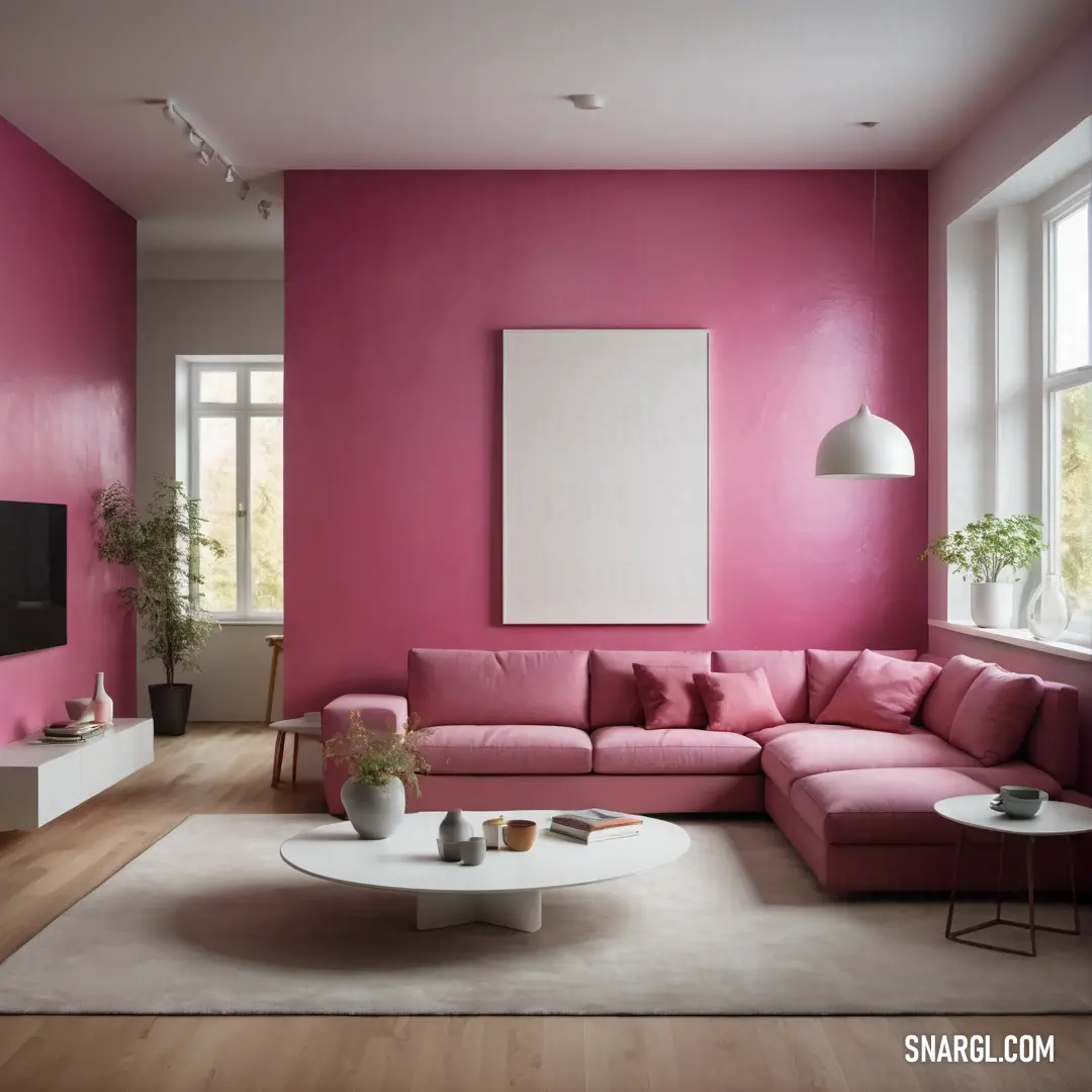 Sangria color. Living room with a pink couch and a white coffee table in front of a large window with a large picture frame