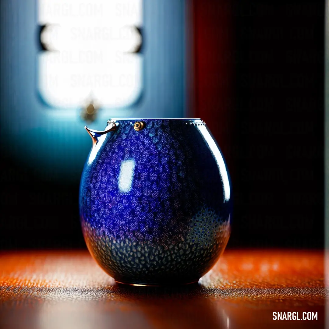 Blue vase on a wooden table in front of a window with a light coming through it and a small window behind it
