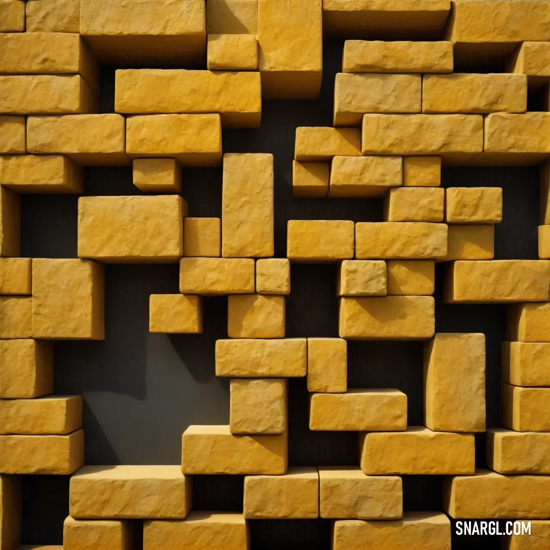 Wall made of yellow bricks with a shadow on it's side. Color #CBA135.