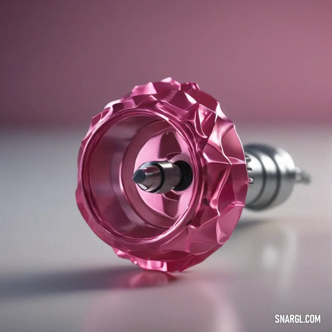 Sky magenta color. Pink metal object with a screw in it's center and a pink background