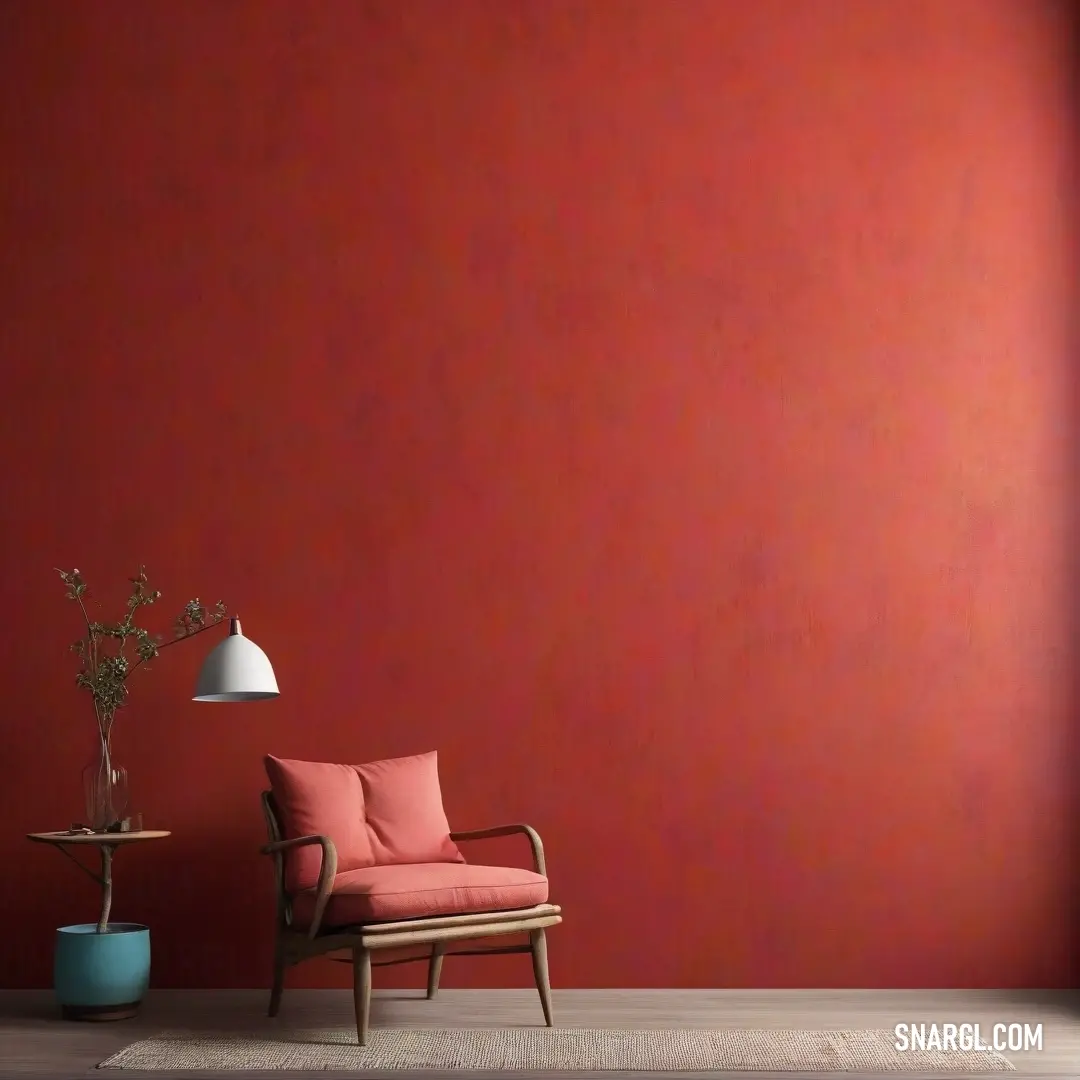 Chair and a table in a room with a red wall and a lamp on the floor. Example of RGB 147,61,65 color.