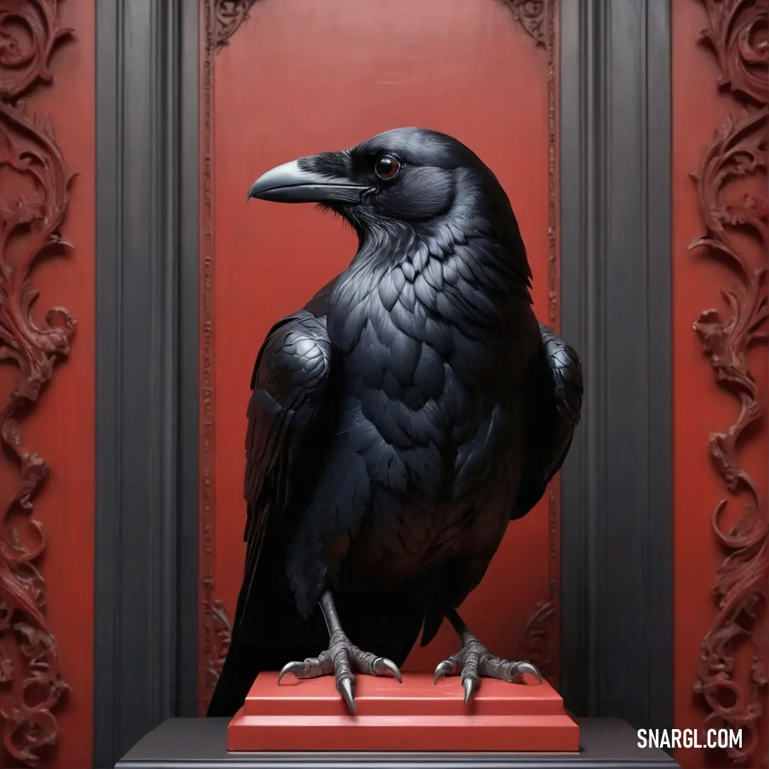 Black bird on top of a red box in front of a red door with ornate carvings on it. Example of RGB 16,12,8 color.