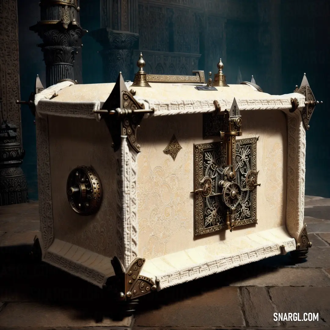 White and gold chest with a clock on it's side and a candle holder in the background