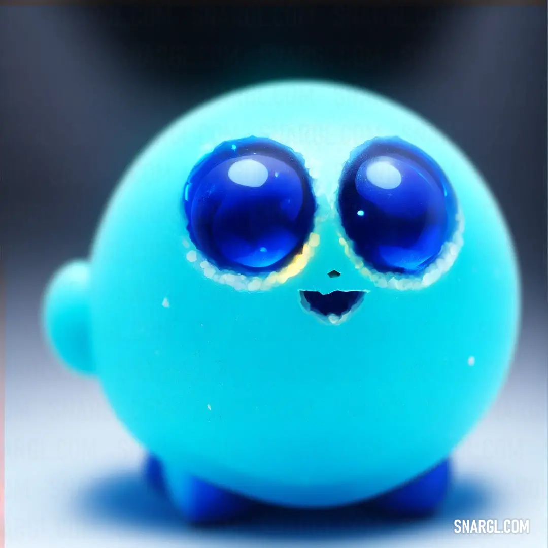 Blue toy with big eyes and a smile on it's face
