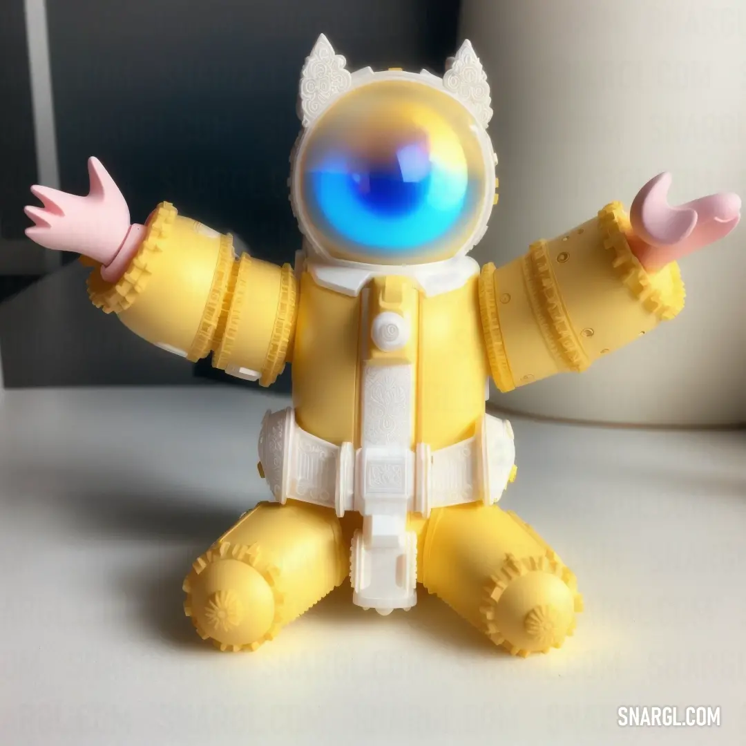 Yellow toy with a blue light on it's face and arms and legs