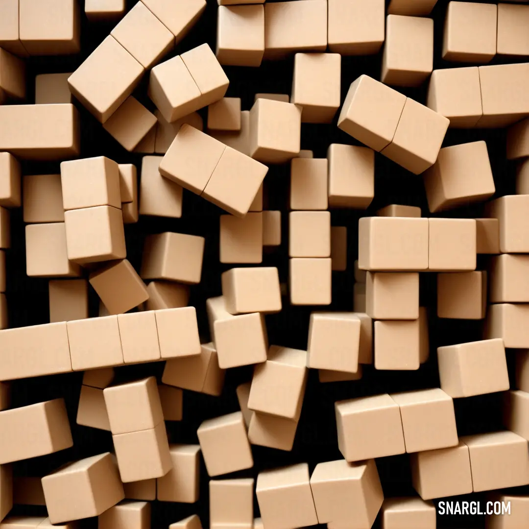 Pile of small brown blocks next to each other on a table top with a black background. Color #FAD6A5.