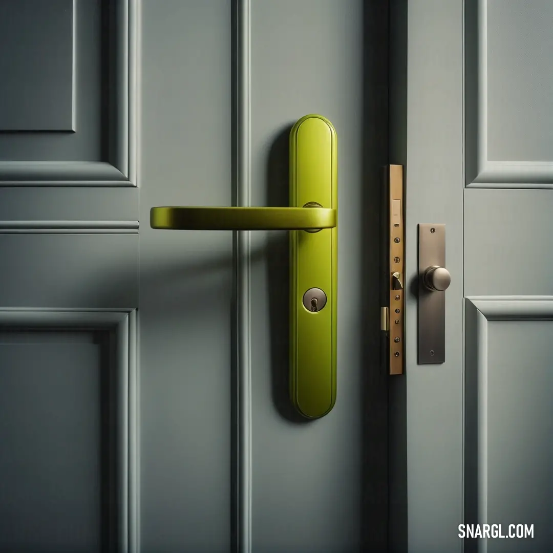 Green door handle on a grey door with a yellow handle on it. Color #748500.